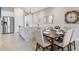 Open concept dining area with kitchen island and seating at 7571 Sunny Dreams Ln, Kissimmee, FL 34747
