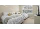 Spacious bedroom with two queen beds and large window at 7571 Sunny Dreams Ln, Kissimmee, FL 34747