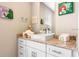 Charming bathroom with single vanity and Little Mermaid decor at 7571 Sunny Dreams Ln, Kissimmee, FL 34747