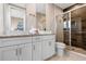 Bathroom with double vanity and walk-in shower at 7571 Sunny Dreams Ln, Kissimmee, FL 34747