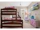 A charming bedroom with a bunk bed and fun decor at 7571 Sunny Dreams Ln, Kissimmee, FL 34747