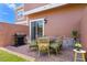 Private patio with table, chairs, and grill at 7571 Sunny Dreams Ln, Kissimmee, FL 34747