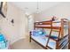 bedroom with a bunk bed and Frozen-themed decor at 7571 Sunny Dreams Ln, Kissimmee, FL 34747