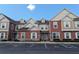 Townhouse exterior with parking and appealing curb appeal at 7571 Sunny Dreams Ln, Kissimmee, FL 34747