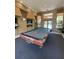 Game room with a billiard table and comfortable seating at 5518 Metrowest Blvd # 207, Orlando, FL 32811