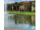 Tranquil lake view with apartment buildings at 5518 Metrowest Blvd # 207, Orlando, FL 32811