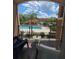 Relaxing balcony view overlooking the community pool and lush landscaping at 5518 Metrowest Blvd # 207, Orlando, FL 32811