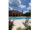 Refreshing community pool and relaxing lounge chairs at 5518 Metrowest Blvd # 207, Orlando, FL 32811