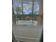 View from window showing a community pool and lush landscaping at 5518 Metrowest Blvd # 207, Orlando, FL 32811