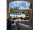 Balcony overlooking the community pool and courtyard at 5518 Metrowest Blvd # 207, Orlando, FL 32811