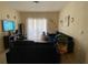 Spacious living room with ample natural light and comfortable seating at 5518 Metrowest Blvd # 207, Orlando, FL 32811