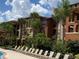 Building exterior showcasing architectural details and landscaping at 5518 Metrowest Blvd # 207, Orlando, FL 32811