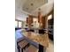 Community kitchen with granite countertops and modern appliances at 5518 Metrowest Blvd # 207, Orlando, FL 32811