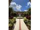 Landscaped courtyard with a fountain and walking paths at 5518 Metrowest Blvd # 207, Orlando, FL 32811