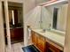 Bathroom with double vanity and view of second sink at 132 Meadow Blvd, Sanford, FL 32771