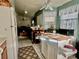 Kitchen with island, white cabinets and view to living room at 132 Meadow Blvd, Sanford, FL 32771