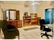 Bedroom with dresser, bookcase, and home office setup at 132 Meadow Blvd, Sanford, FL 32771