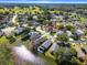 Wide view of a neighborhood with a lake, homes, and greenery at 132 Meadow Blvd, Sanford, FL 32771
