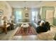 Bright living room with ample seating and a coffee table at 132 Meadow Blvd, Sanford, FL 32771