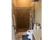 Bathroom with walk-in shower and neutral tile at 132 Meadow Blvd, Sanford, FL 32771