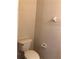 Small bathroom with toilet and wall shelf at 3514 Victoria Pines Dr # 148, Orlando, FL 32829