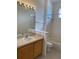 Bathroom with tub, sink, and mirror at 3514 Victoria Pines Dr # 148, Orlando, FL 32829