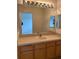 Bathroom with vanity, sink, and large mirror at 3514 Victoria Pines Dr # 148, Orlando, FL 32829