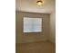 Simple bedroom with window and carpet at 3514 Victoria Pines Dr # 148, Orlando, FL 32829