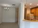 Bright dining room with chandelier and access to kitchen at 3514 Victoria Pines Dr # 148, Orlando, FL 32829