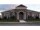 Community clubhouse with landscaping and a grand entrance at 3514 Victoria Pines Dr # 148, Orlando, FL 32829