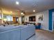 Open Gathering room with sectional sofa and TV at 8887 Qin Loop, Kissimmee, FL 34747
