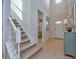 Elegant staircase with white railing and carpeted steps at 8887 Qin Loop, Kissimmee, FL 34747