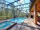 Relaxing pool and spa with screened enclosure at 8887 Qin Loop, Kissimmee, FL 34747