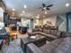 Open concept living room with kitchen view and sectional sofa at 8887 Qin Loop, Kissimmee, FL 34747