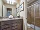 Bathroom with granite countertop, double vanity, and shower/tub combo at 8887 Qin Loop, Kissimmee, FL 34747
