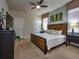 Spacious main bedroom with king-size bed and large windows at 8887 Qin Loop, Kissimmee, FL 34747