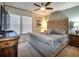 Main bedroom with a king-size bed and plenty of natural light at 8887 Qin Loop, Kissimmee, FL 34747