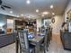 Open concept dining room, seating for 10+ at 8887 Qin Loop, Kissimmee, FL 34747
