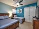 Spacious bedroom with twin and full-size beds, and plenty of closet space at 8887 Qin Loop, Kissimmee, FL 34747