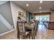 Elegant dining room with large table and access to the pool at 8887 Qin Loop, Kissimmee, FL 34747