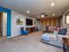 Spacious Gathering room with comfortable seating and accent wall at 8887 Qin Loop, Kissimmee, FL 34747