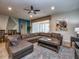 Relaxing living room, sectional sofa, and open floor plan at 8887 Qin Loop, Kissimmee, FL 34747