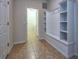 Laundry room with built-in storage and tiled floors at 8887 Qin Loop, Kissimmee, FL 34747
