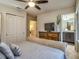 Main bedroom with king-size bed and en-suite bathroom at 8887 Qin Loop, Kissimmee, FL 34747