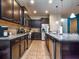 Spacious kitchen, granite countertops, dark cabinets at 8887 Qin Loop, Kissimmee, FL 34747