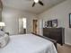Bright bedroom with a comfortable bed, dresser, and TV at 8887 Qin Loop, Kissimmee, FL 34747