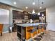 Modern kitchen with island and stainless steel appliances at 8887 Qin Loop, Kissimmee, FL 34747