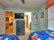 Bedroom with twin beds, dresser, and access to bathroom at 8887 Qin Loop, Kissimmee, FL 34747