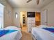 Twin bedroom with Frozen bedding and view of bathroom at 8887 Qin Loop, Kissimmee, FL 34747