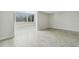Bright living room with tile floors and large window at 311 E Morse Blvd # 7-2, Winter Park, FL 32789